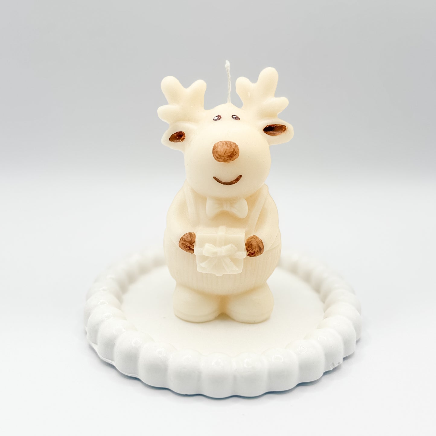 Reno con regalo Vela